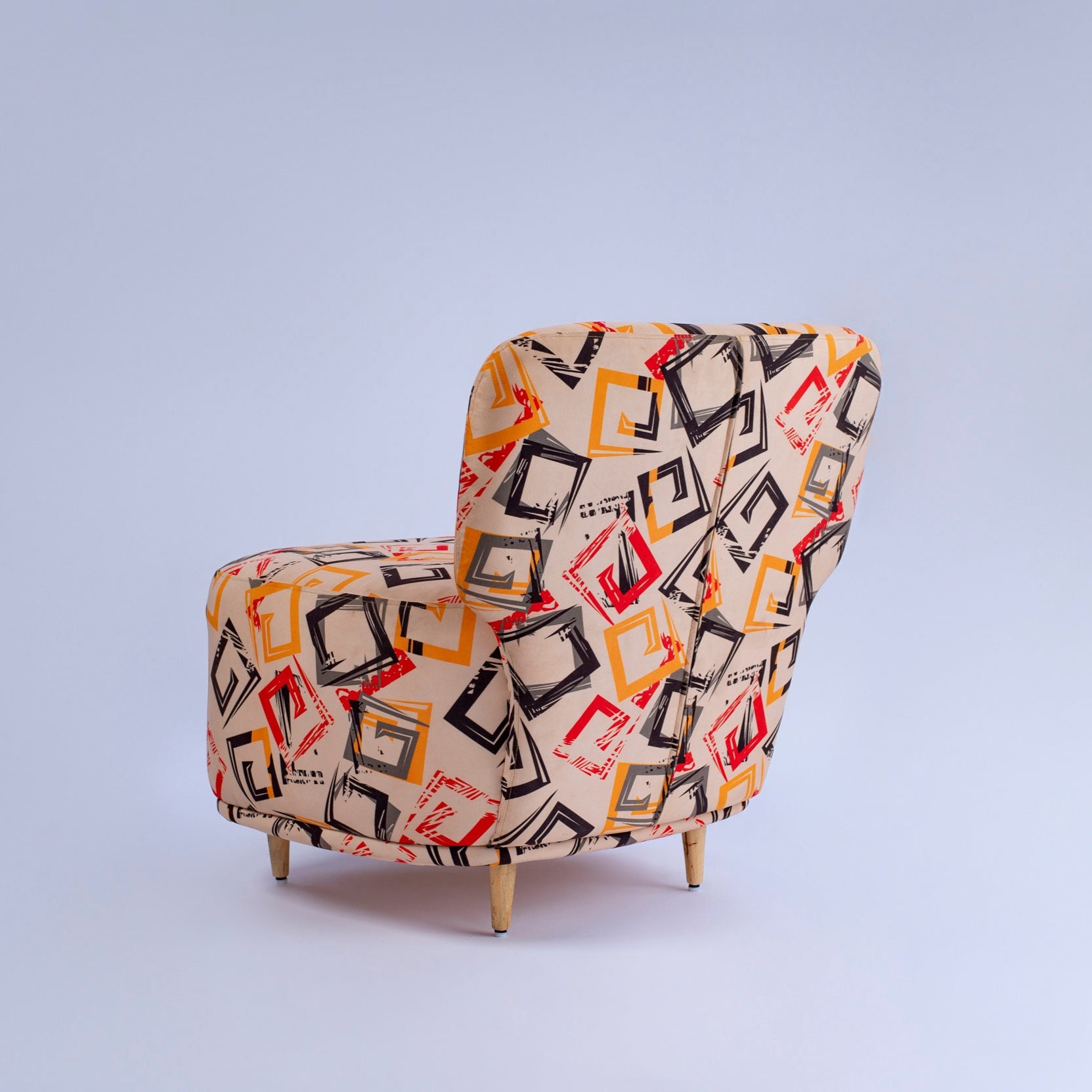 Patterned armchair on a light gray background