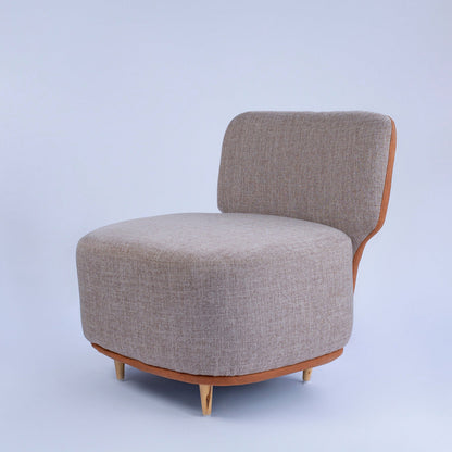 Gray upholstered chair with wooden legs on a light gray background The Seating Company 