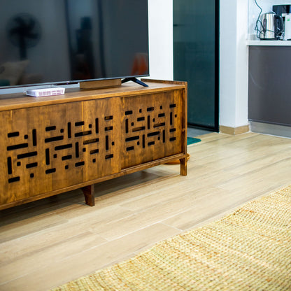 Wooden sideboard with decorative patterns in a modern living room.